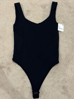 Free People Black Scoop Neck One-Piece button up Bodysuit